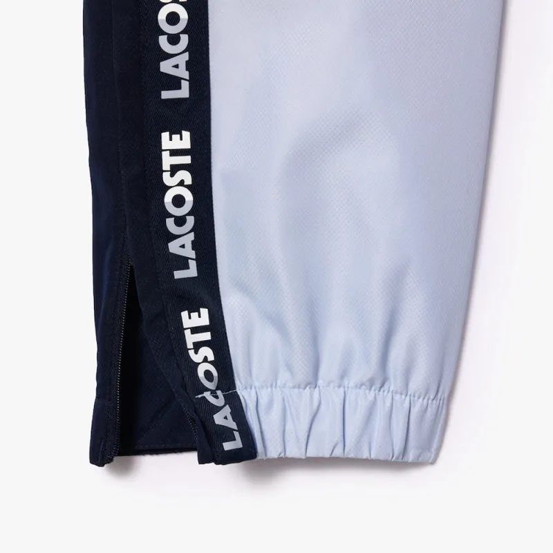 PANTALON DE SURVÊTEMENT LACOSTE TENNIS SPORTSUIT DOUBLÉ BLEU MARINE ET BLEU
